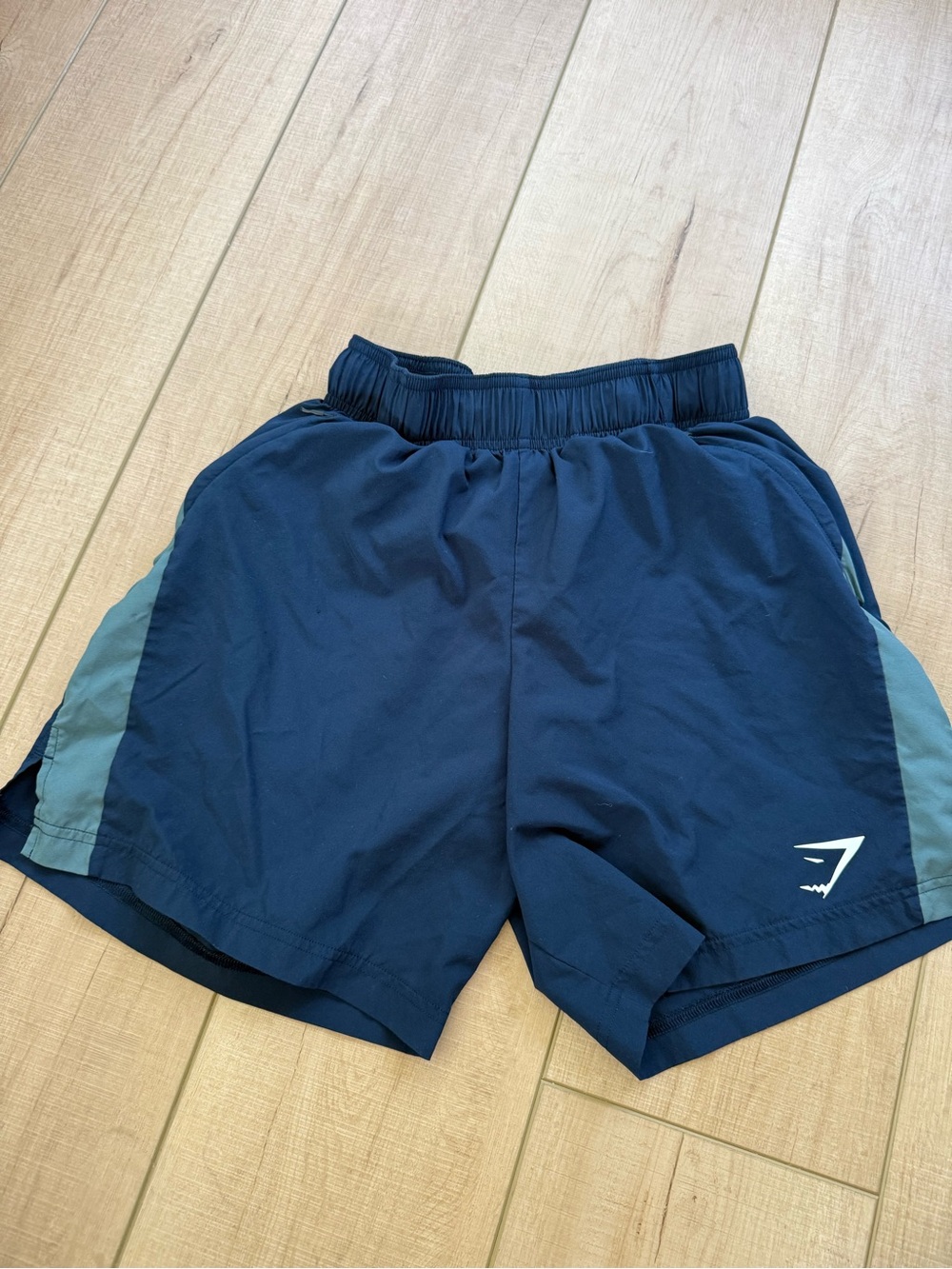 Gymshark Navy Athletic Shorts with Light Blue Side Panels